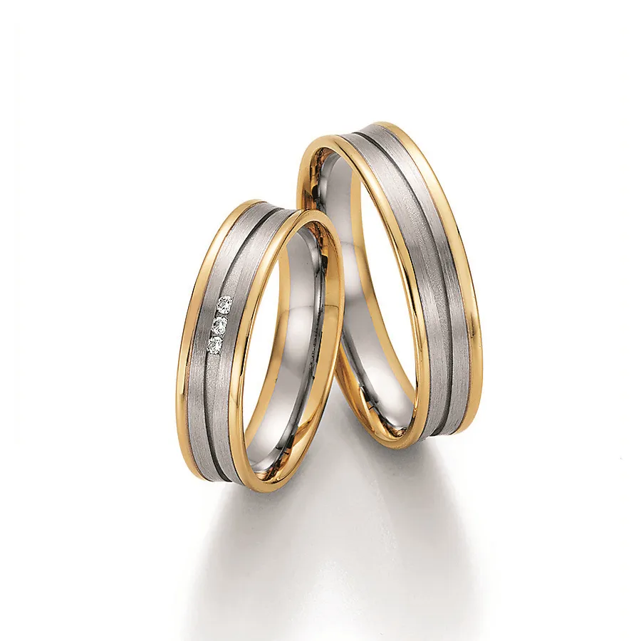 Alianzas de boda de oro amarillo y oro blanco con diamantes