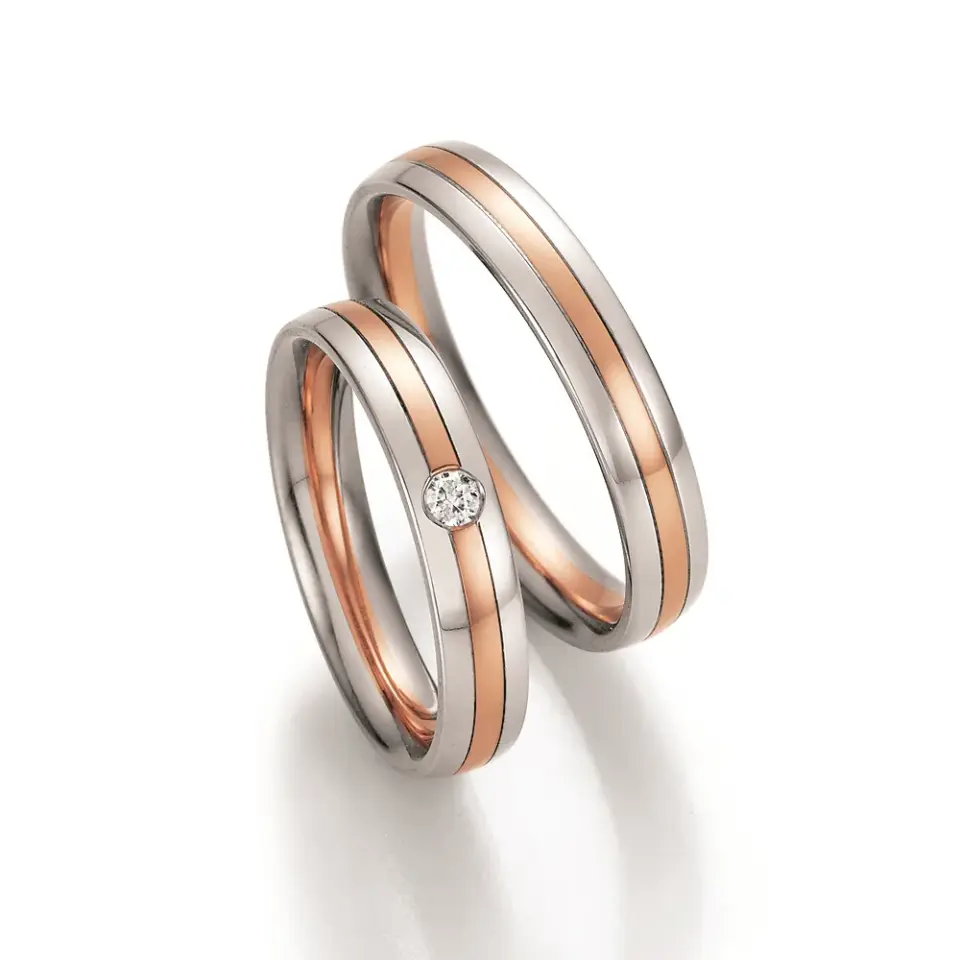 Alianzas de boda de paladio y oro rosado con diamante
