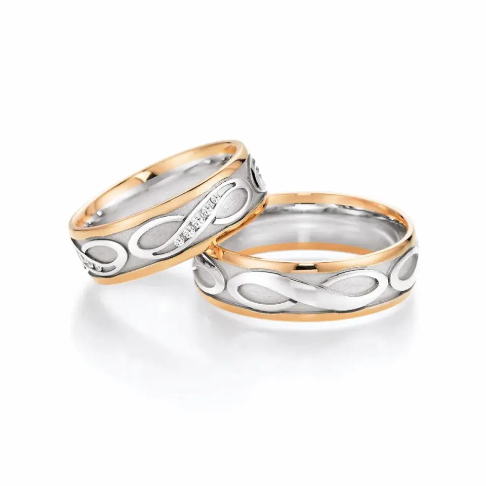Alianzas de boda de oro rosado y paladio con diamantes