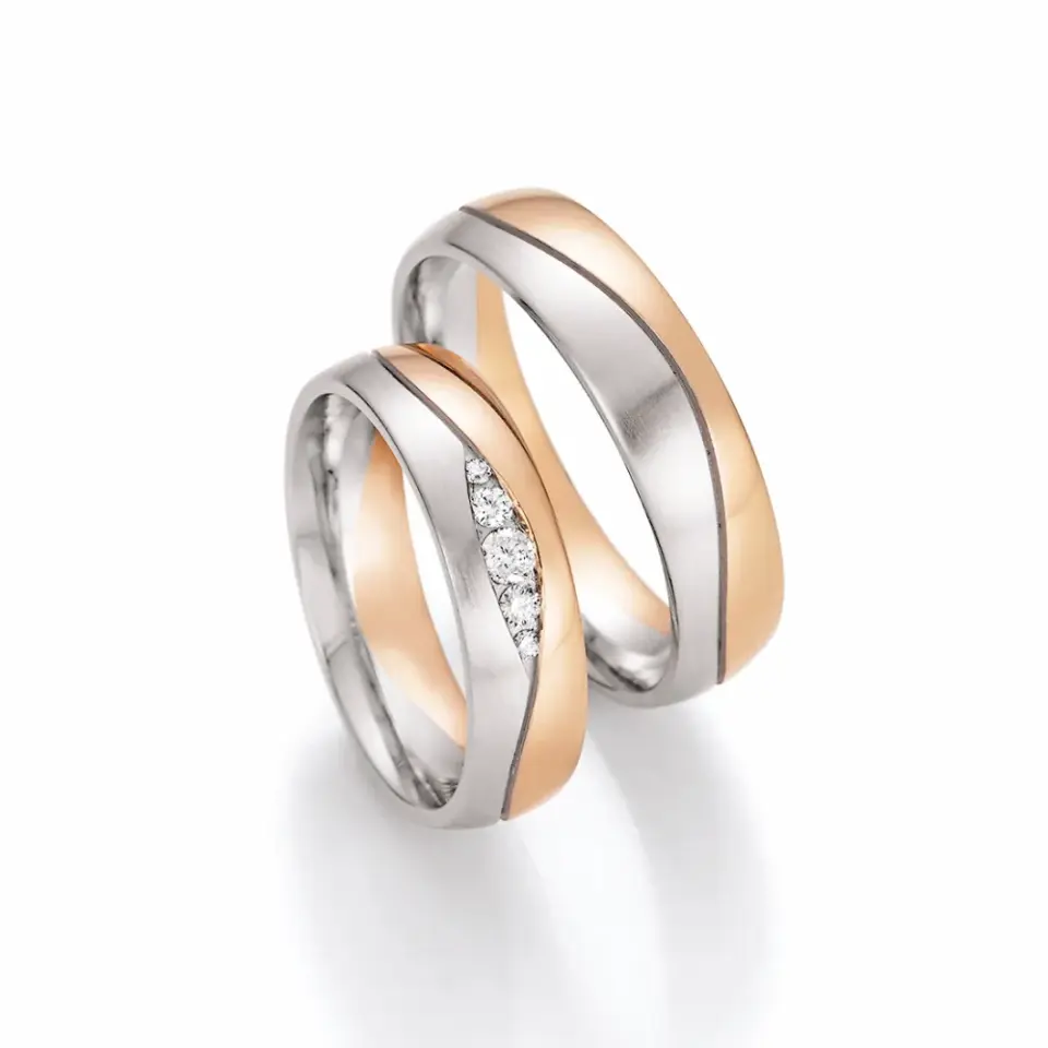 Alianzas de boda de platino y oro rosado con diamantes