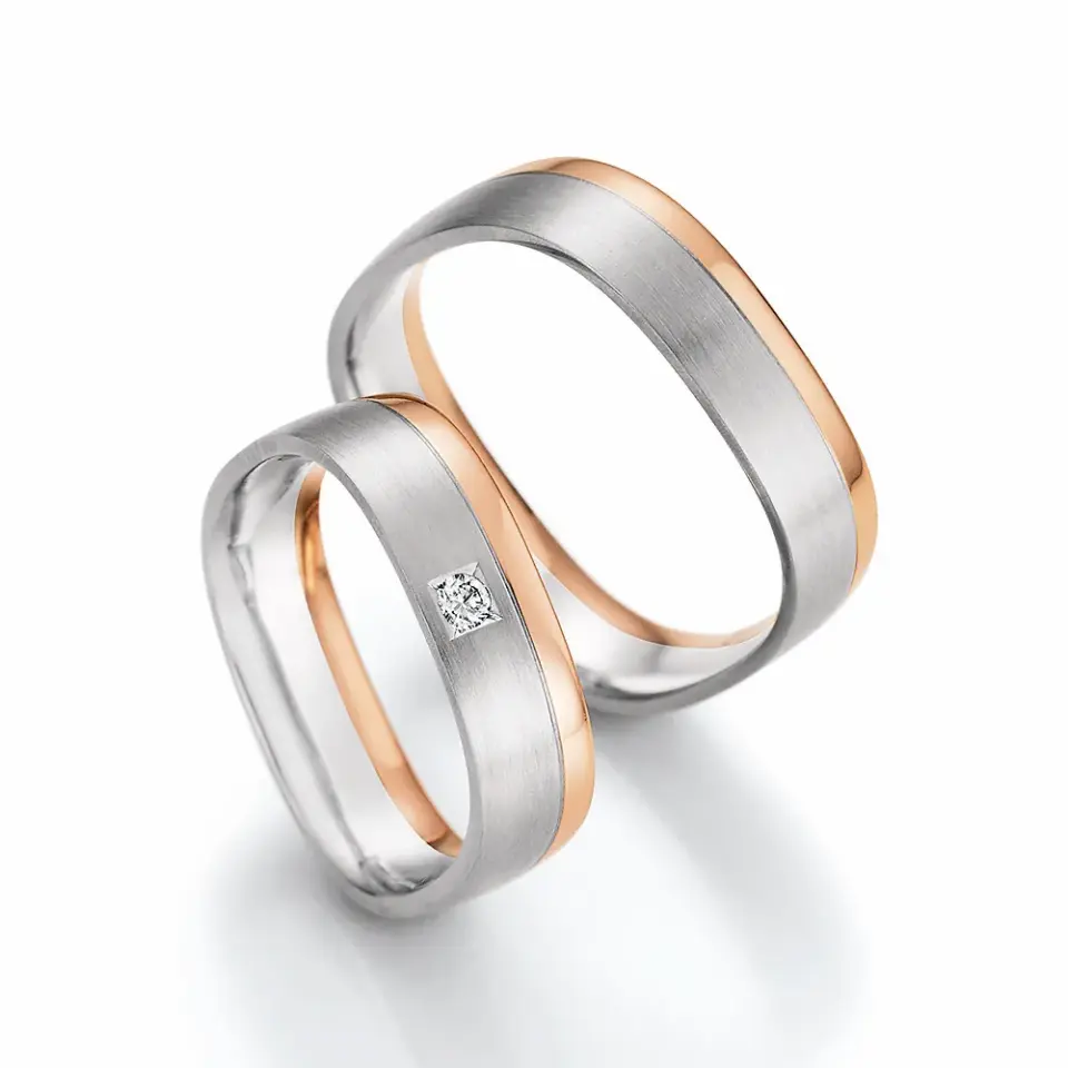 Alianzas de boda de oro blanco y oro rosado con diamante