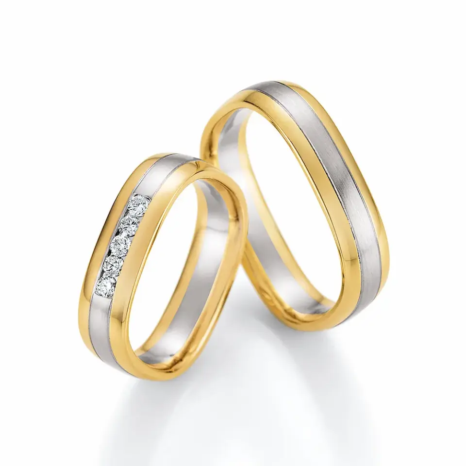 Alianzas de boda de oro amarillo y platino con diamantes