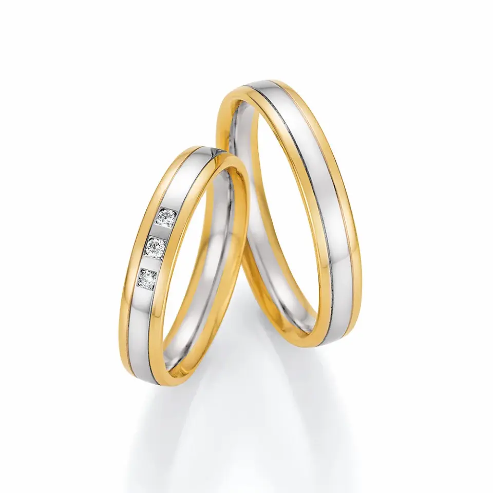 Alianzas de boda de oro amarillo y oro blanco con diamantes
