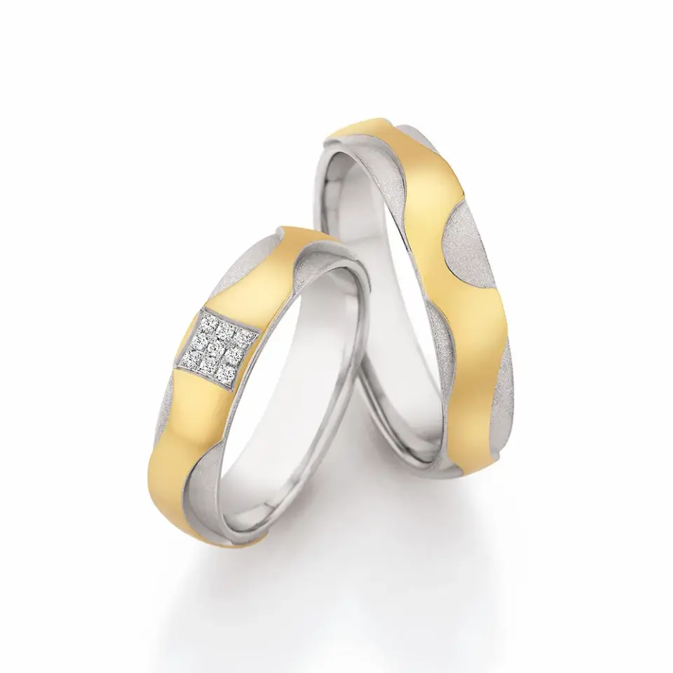 Alianzas de boda de oro amarillo y paladio con diamantes