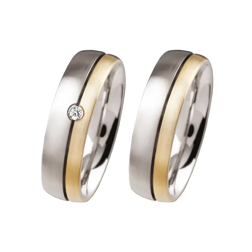 Alianzas de boda de acero y oro amarillo con diamante