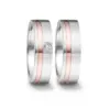 Alianzas de boda de acero y oro rosado con diamante