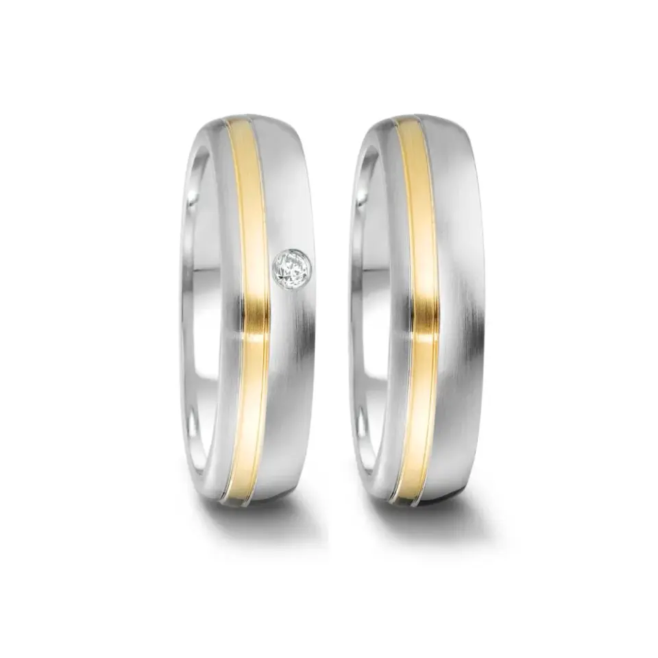 Alianzas de boda de acero y oro amarillo con diamante