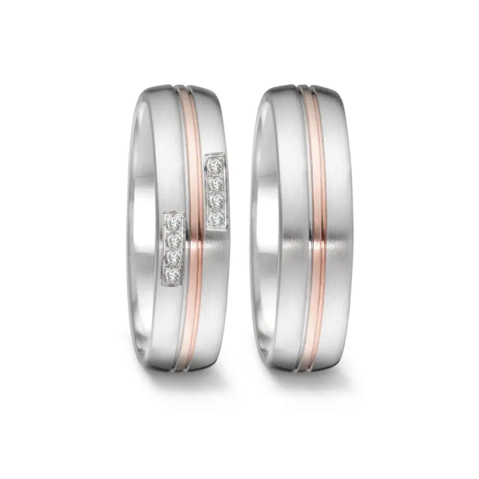 Alianzas de boda de acero y oro rosado con diamantes