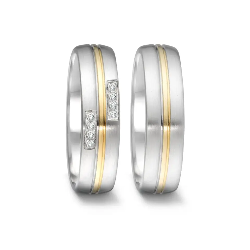 Alianzas de boda de acero y oro amarillo con diamantes