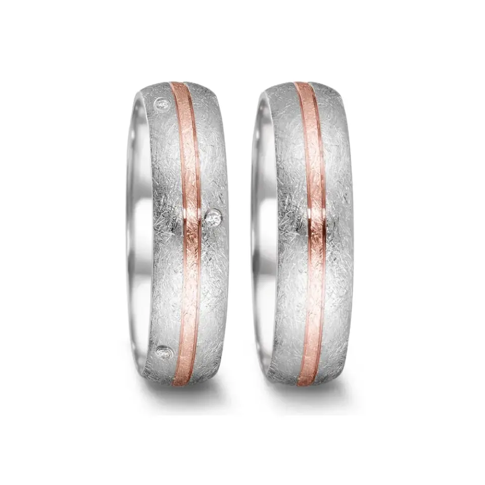 Alianzas de boda de acero y oro rosado con diamantes