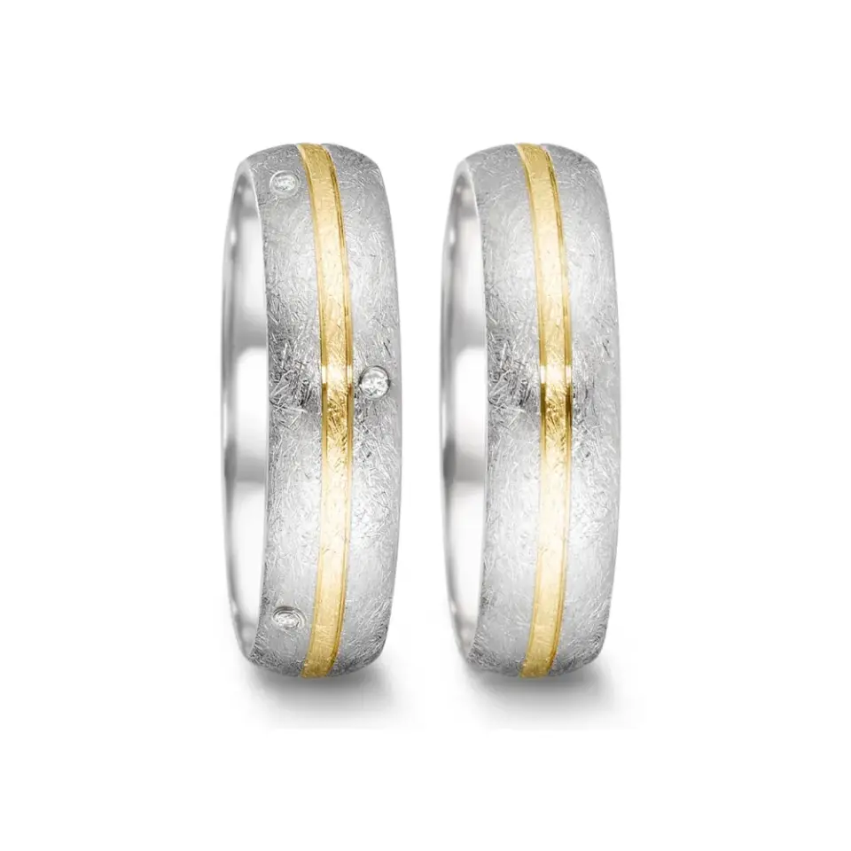 Alianzas de boda de acero y oro amarillo con diamantes
