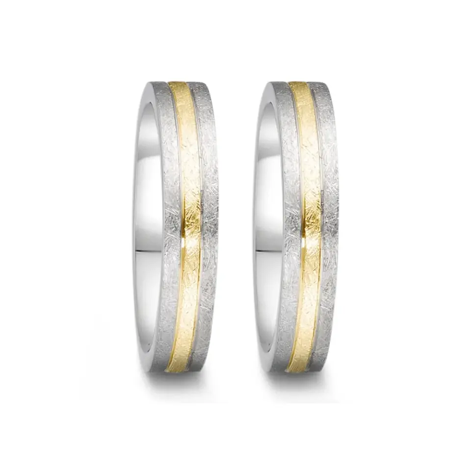 Alianzas de boda de acero y oro amarillo