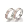Alianzas de boda de acero y oro rosado