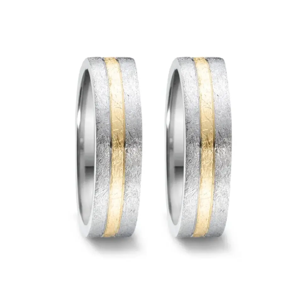 Alianzas de boda de acero y oro amarillo