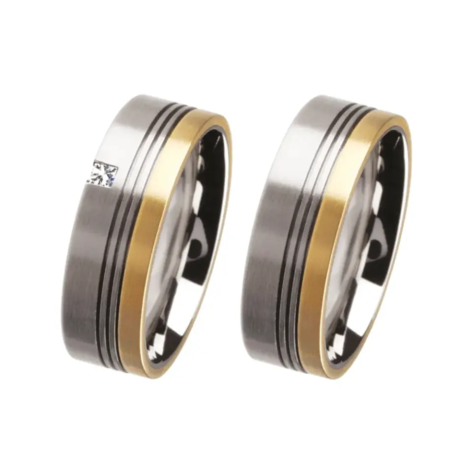 Alianzas de boda de acero y oro amarillo con diamante