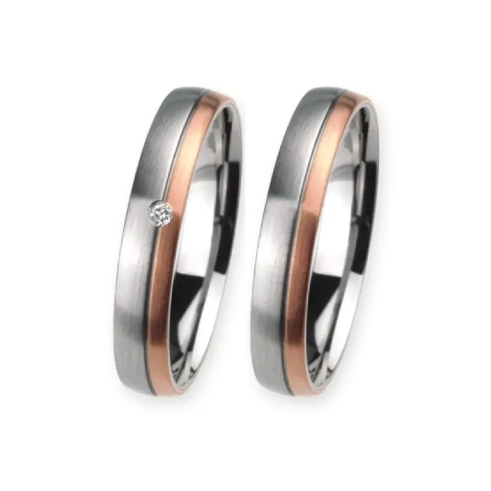 Alianzas de boda de acero y oro rosado con diamante