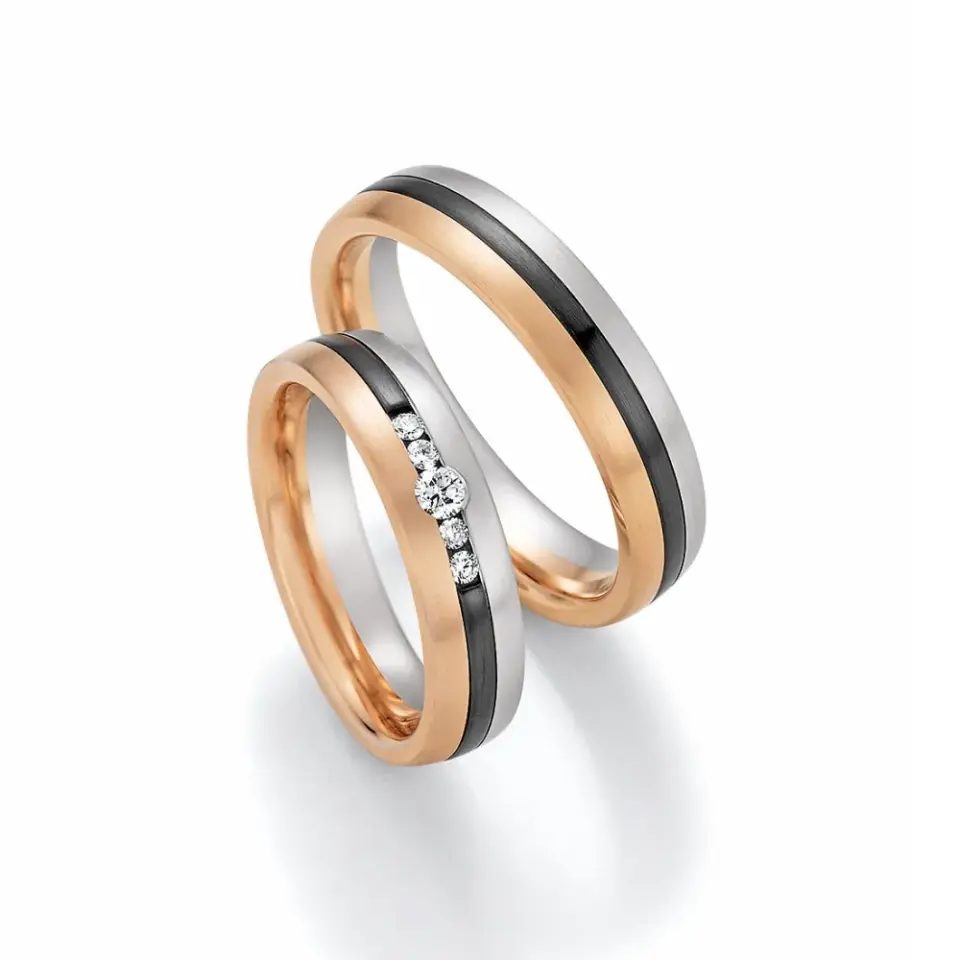Alianzas de boda de oro rosado y zirconio con diamantes