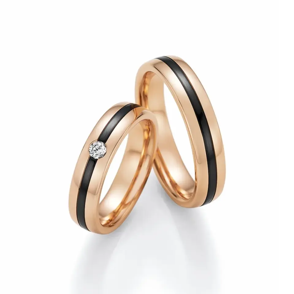 Alianzas de boda de oro rosado y zirconio con diamante
