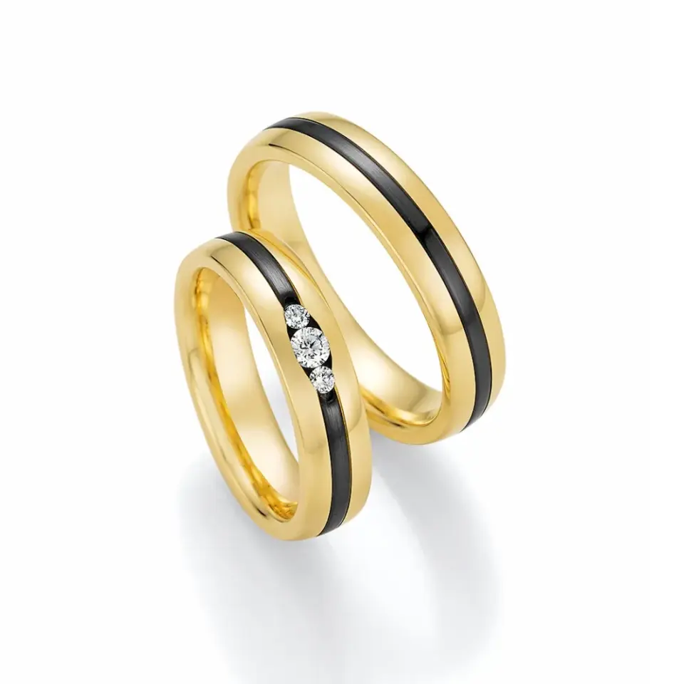 Alianzas de boda de oro amarillo y zirconio con diamantes
