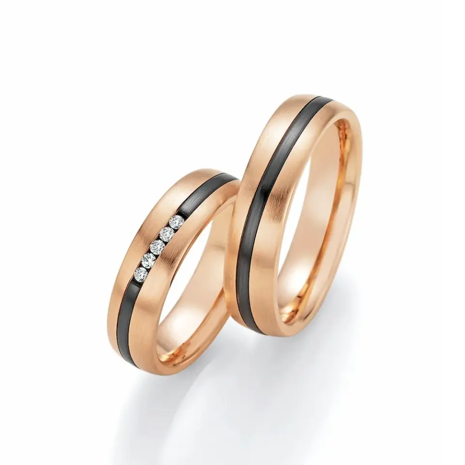 Alianzas de boda de oro rosado y zirconio con diamantes