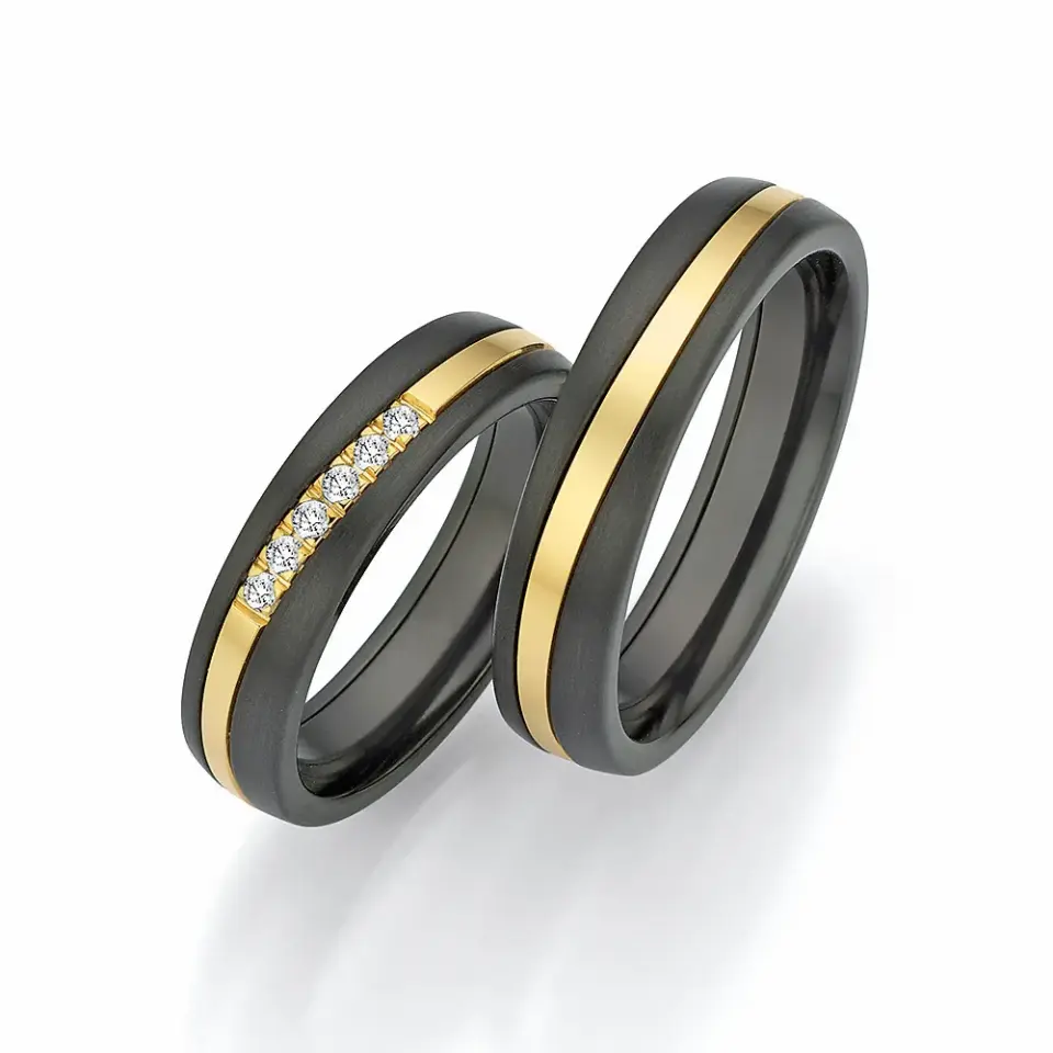 Alianzas de boda de zirconio y oro amarillo con diamantes