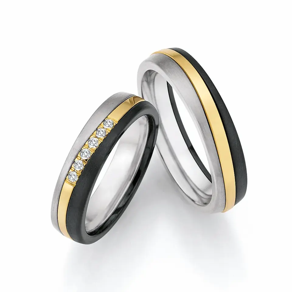 Alianzas de boda de titanio, oro amarillo y zirconio con diamantes