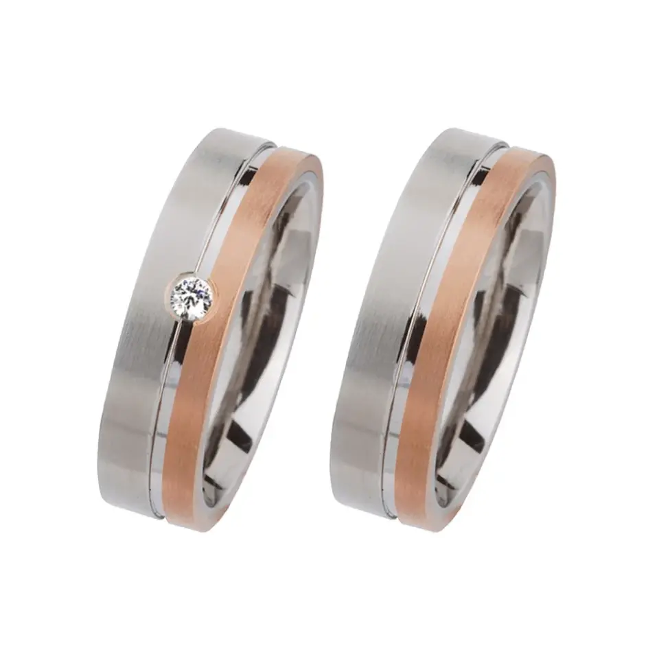 Alianzas de boda de acero y oro rosado con diamante
