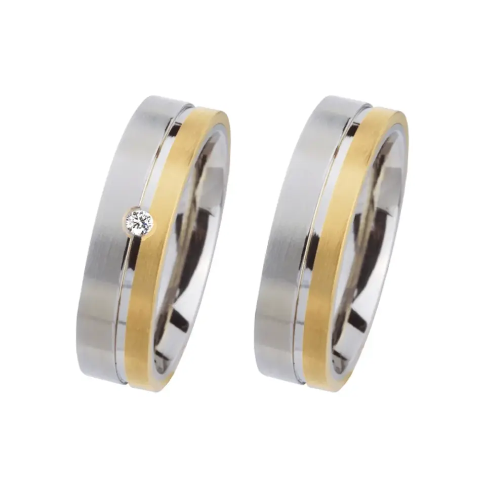 Alianzas de boda de acero y oro amarillo con diamante