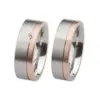 Alianzas de boda de acero y oro rosado con diamante