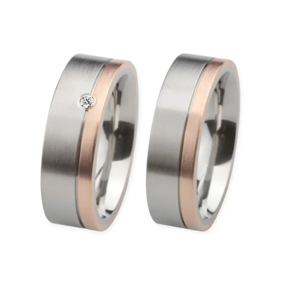 Alianzas de boda de acero y oro rosado con diamante