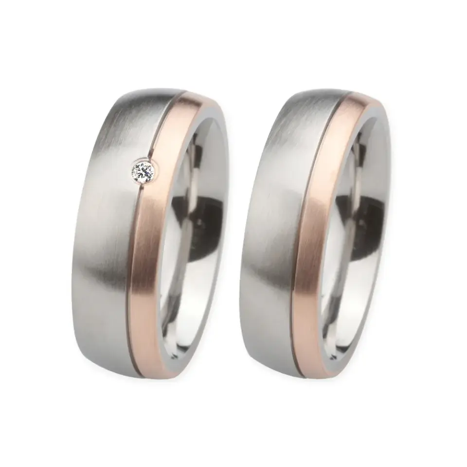 Alianzas de boda de acero y oro rosado con diamante