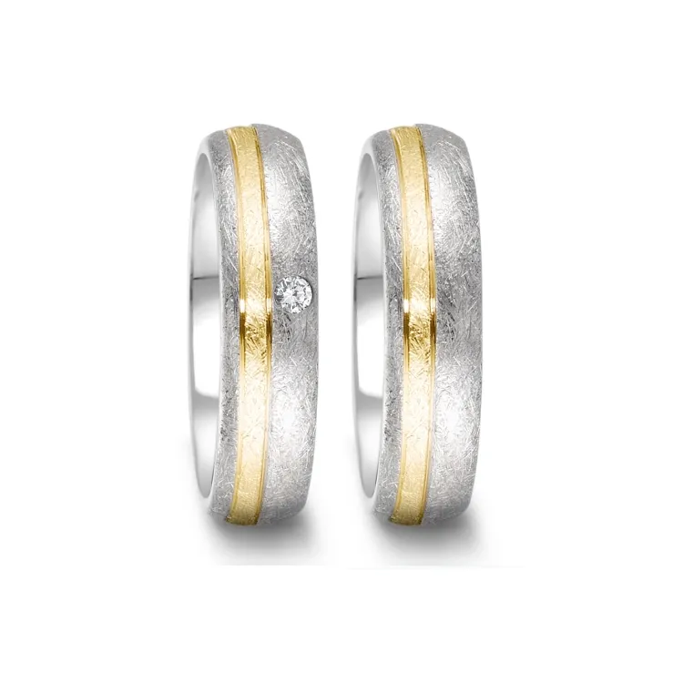 Alianzas de boda de acero y oro amarillo con diamante