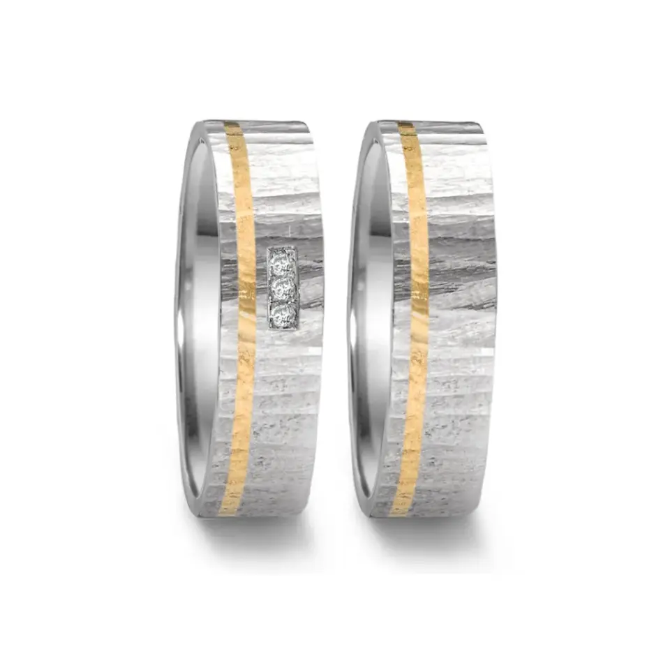 Alianzas de boda de acero y oro amarillo con diamantes