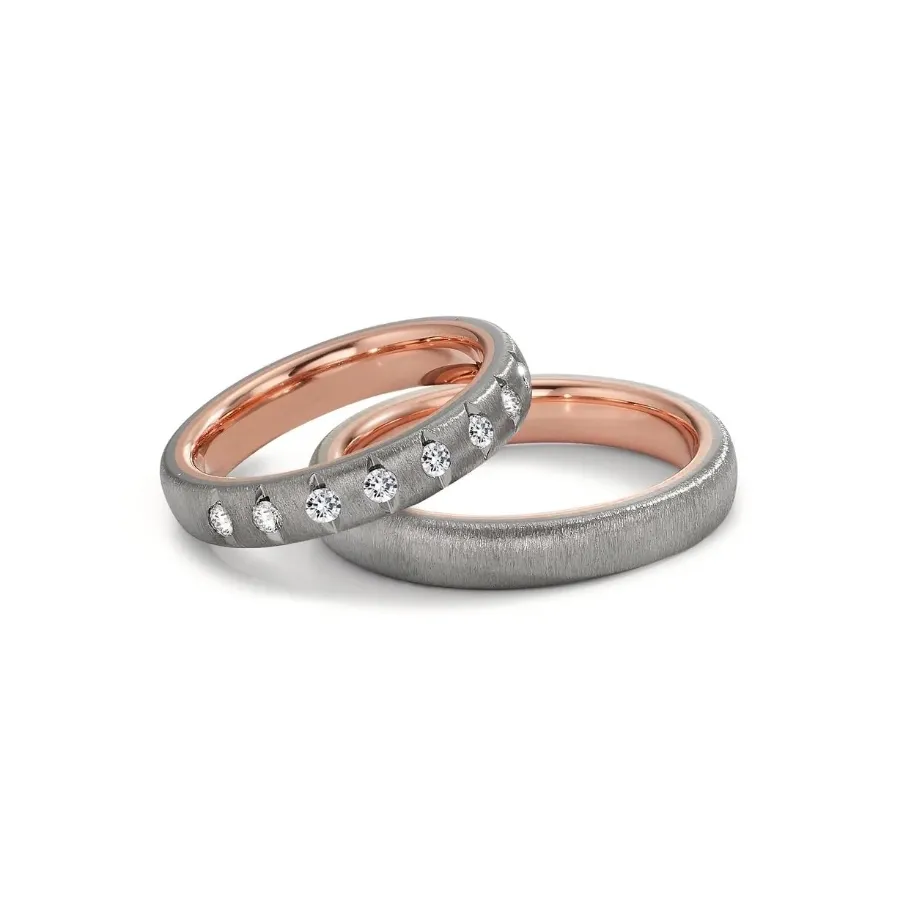 Alianzas de boda de oro rosado y tántalo con diamantes