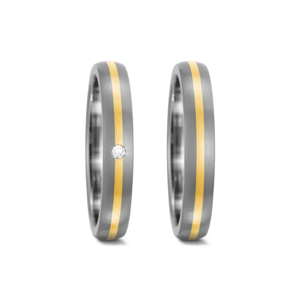 Alianzas de boda de titanio y oro amarillo con diamante