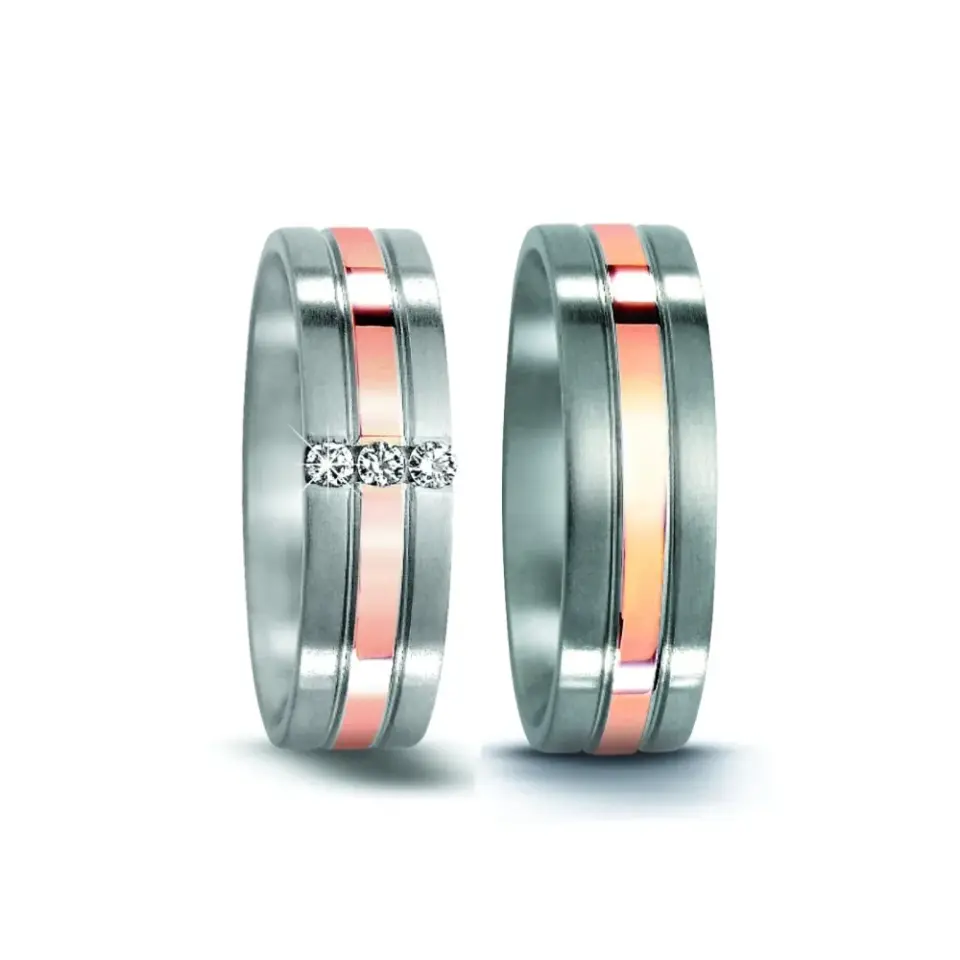 Alianzas de boda de acero y oro rosado con diamantes