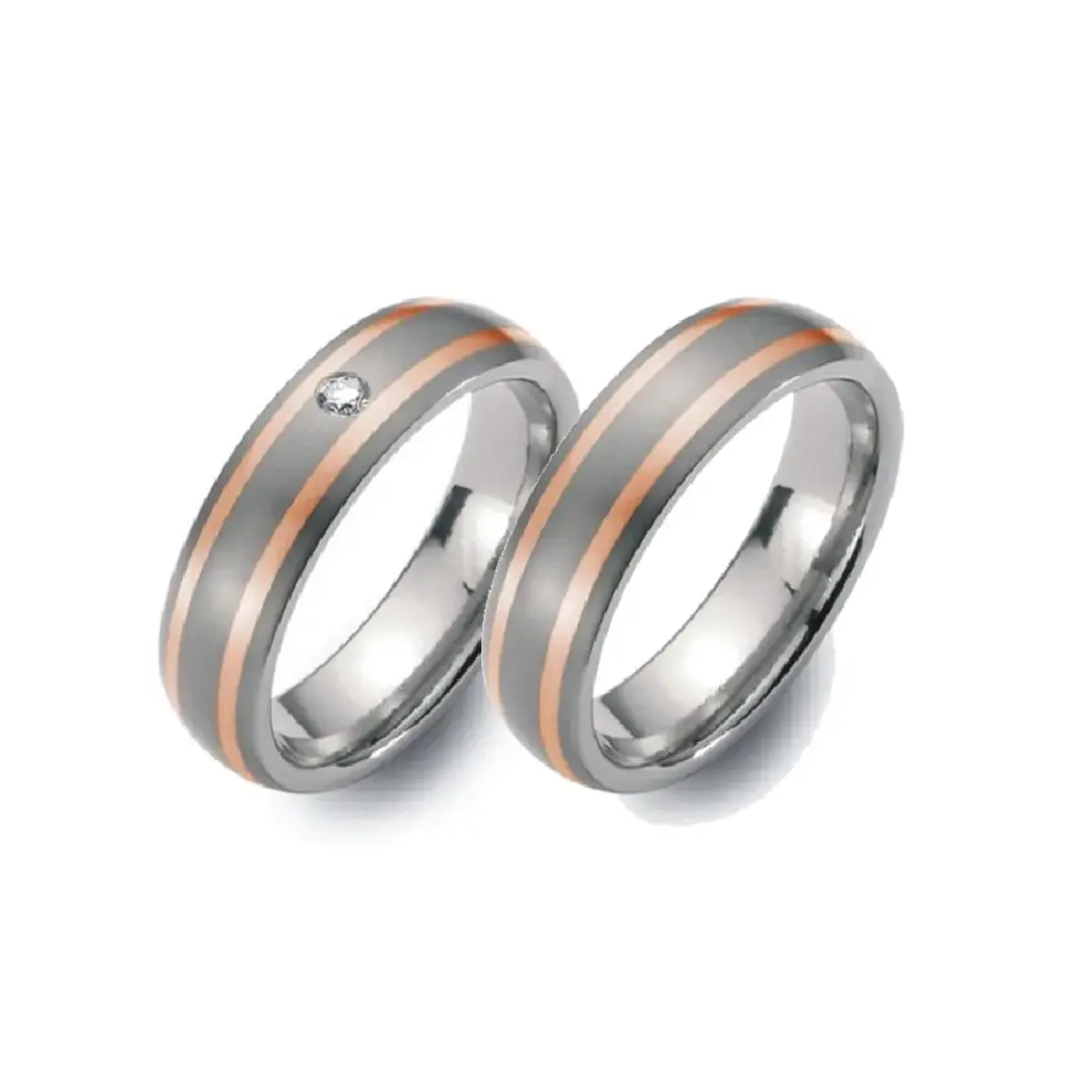 Alianzas de boda de titanio y oro rosado con diamante