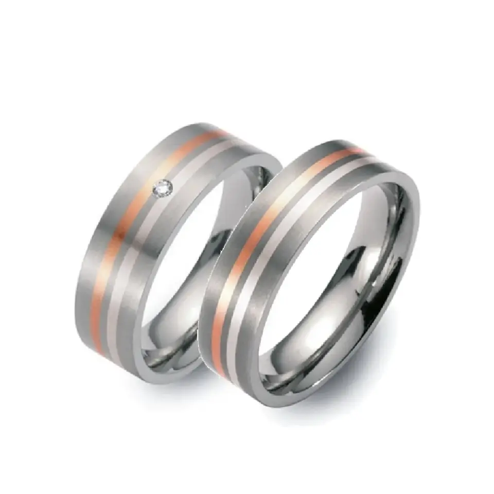 Alianzas de boda de titanio, oro rosado y paladio con diamante
