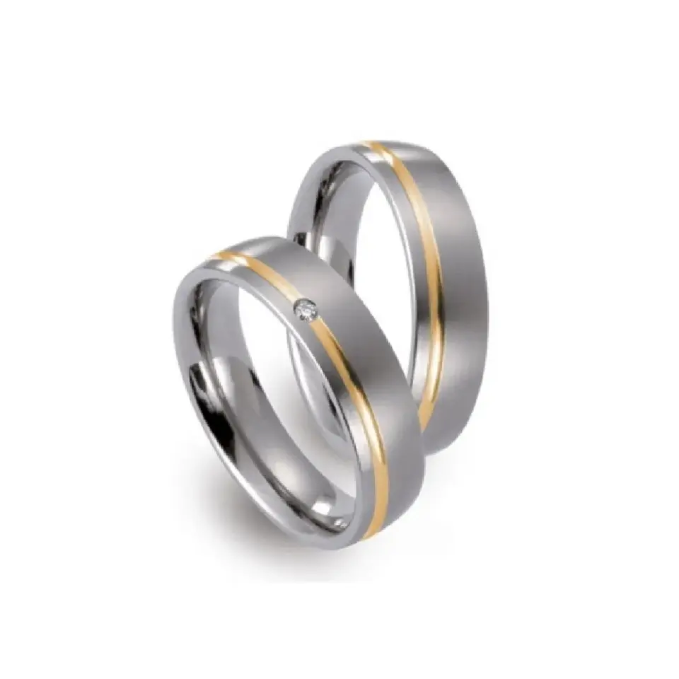 Alianzas de boda de titanio y oro amarillo con diamante
