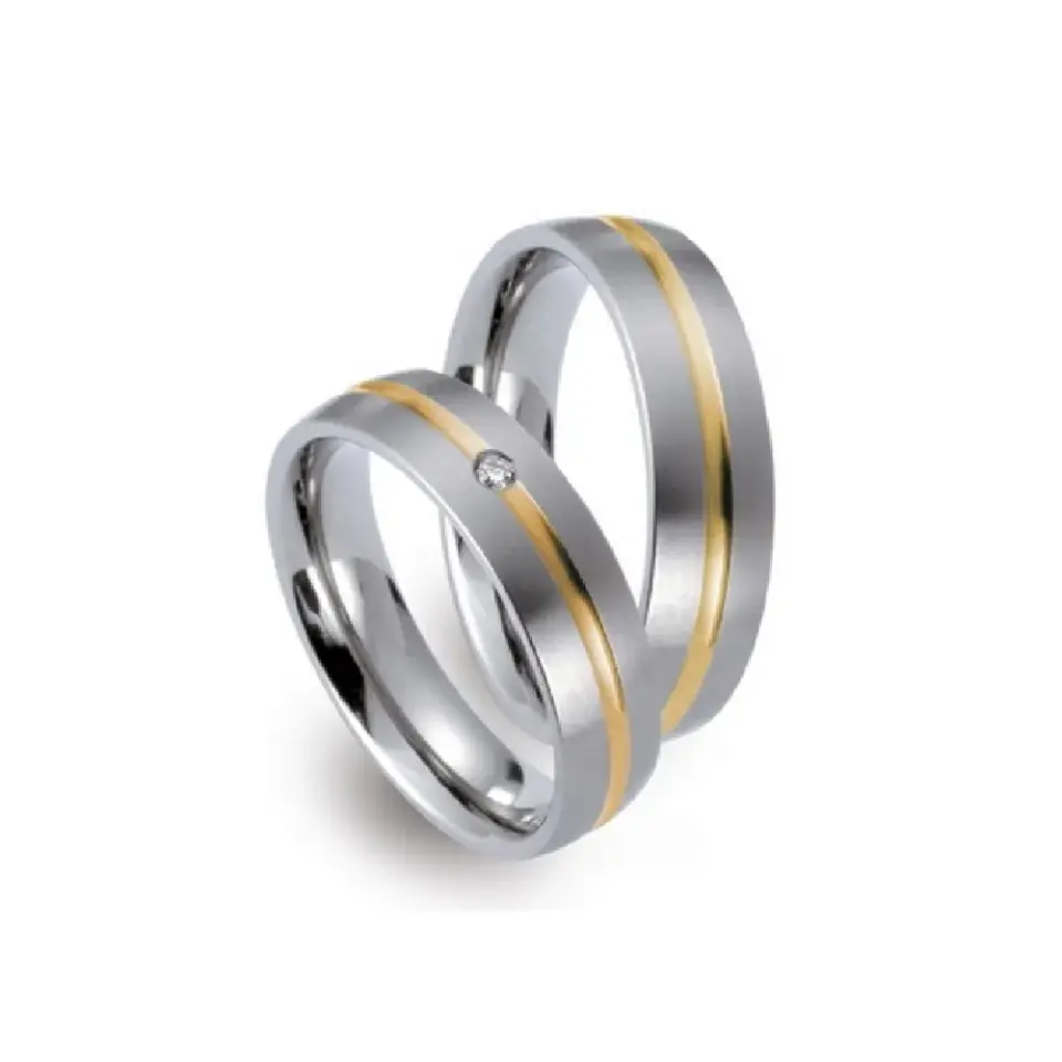Alianzas de boda de titanio y oro amarillo con diamante