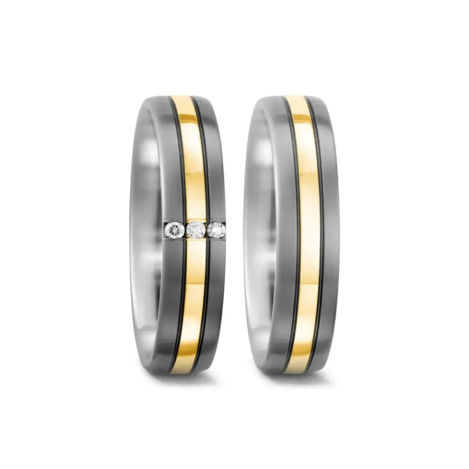 Alianzas de boda de titanio y oro amarillo con diamantes