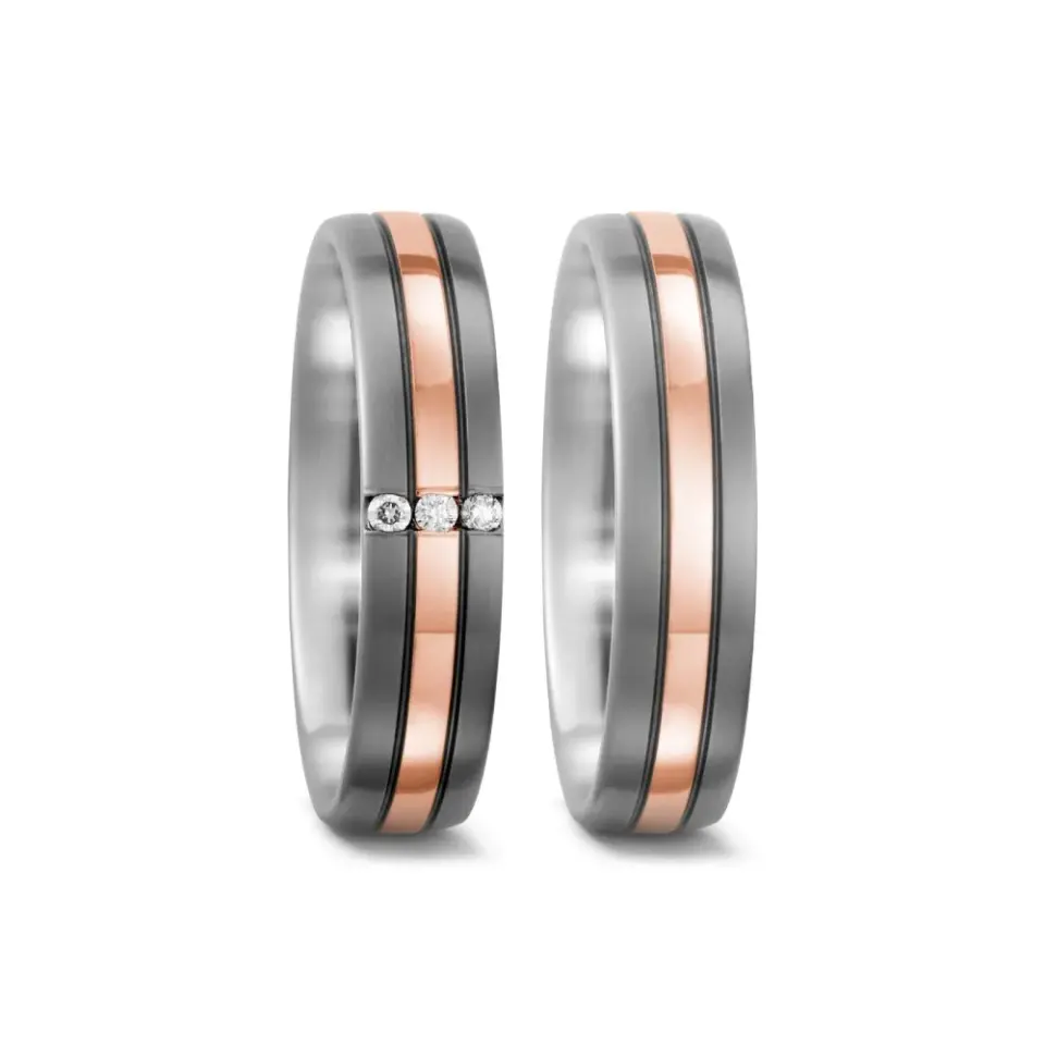 Alianzas de boda de titanio y oro rosado con diamantes