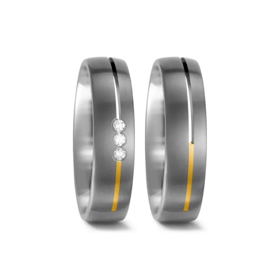 Alianzas de boda de titanio y oro amarillo con diamantes