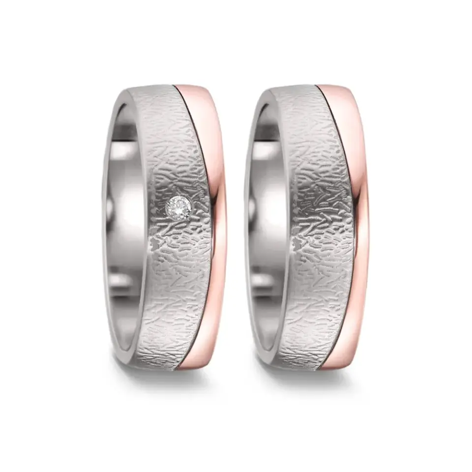 Alianzas de boda de titanio y oro rosado con diamante
