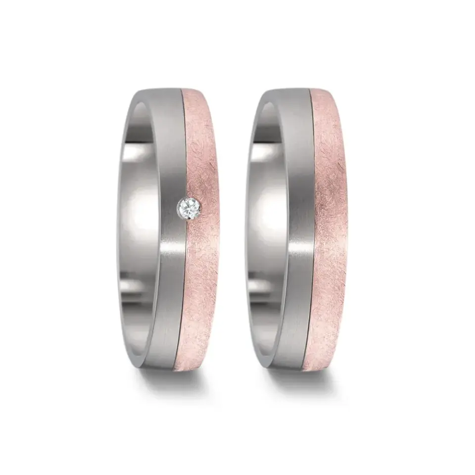 Alianzas de boda de titanio y oro rosado con diamante