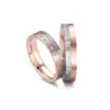 Alianzas de boda de carbono y oro rosado con diamantes