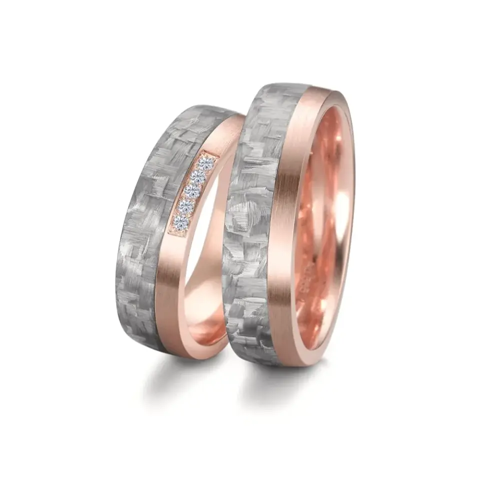 Alianzas de boda de carbono y oro rosado con diamantes