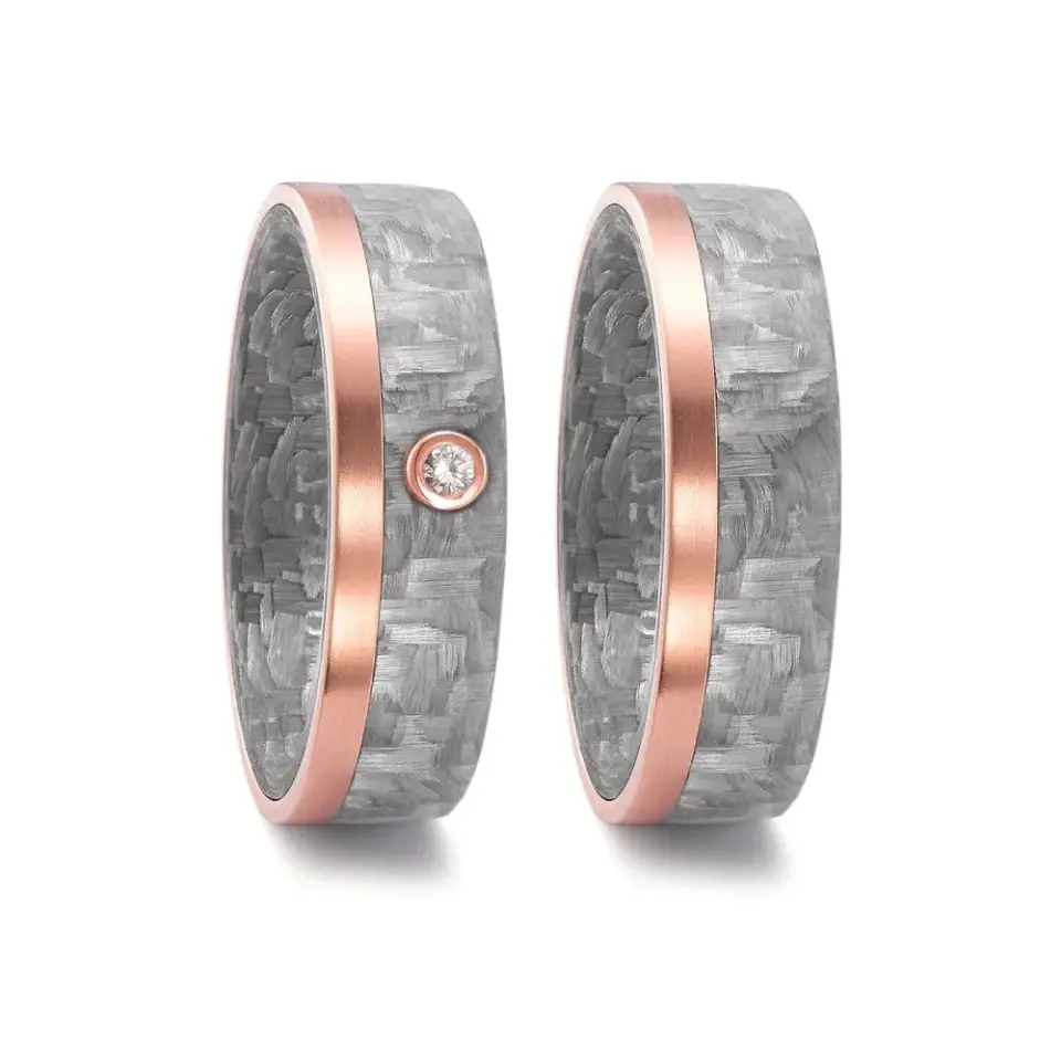 Alianzas de boda de carbono y oro rosado con diamante
