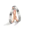 Alianzas de boda de acero y oro rosado con diamante