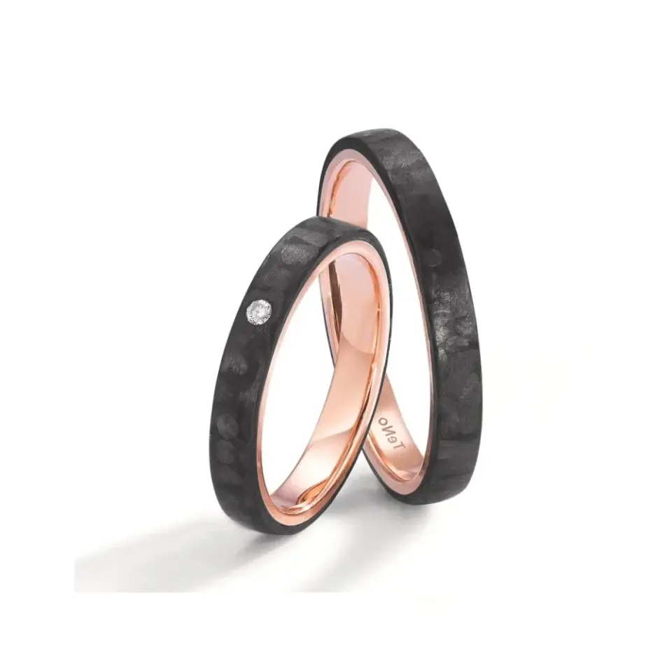 Alianzas de boda de carbono y oro rosado con diamante